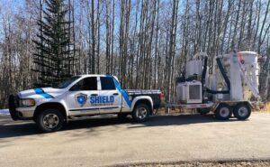 Image of Shield Truck towing the Vector 1 HEPA Vacuum