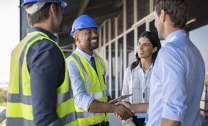 Image of a contractor and client shaking hands.