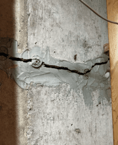 Image of cracked wall with poor foundation repair.