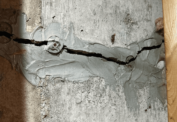 Image of cracked wall with poor foundation repair.