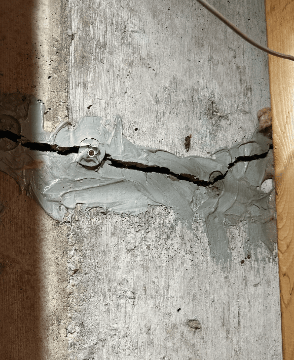 Image of cracked wall with poor foundation repair.