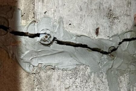 Image of a failed urethane Injection and foundation crack.