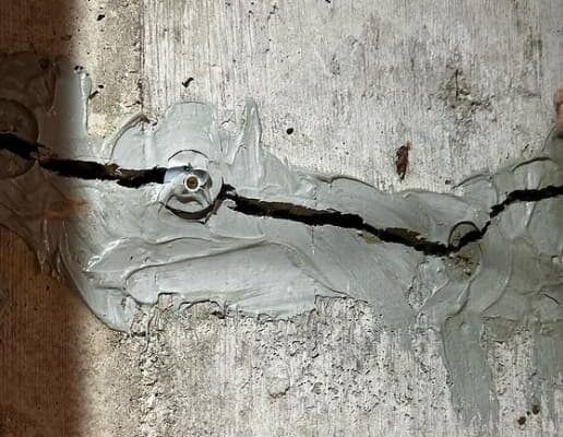 Image of a failed urethane Injection and foundation crack.