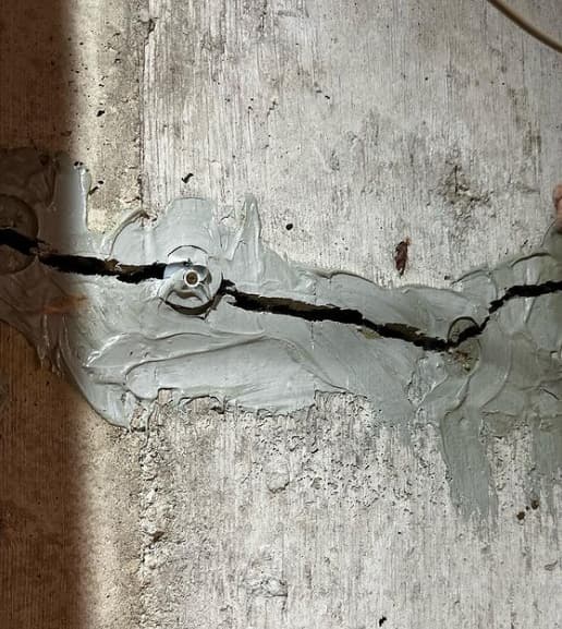 Image of a failed urethane Injection and foundation crack.
