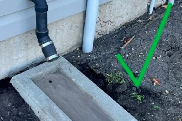 Image of an extended sump pump drainage gutter.